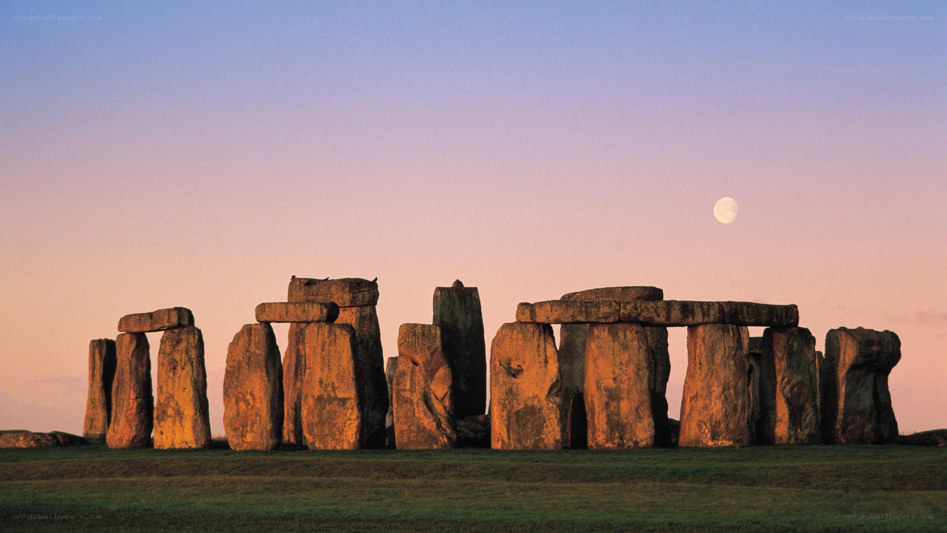 Stonehenge at dusk with moon