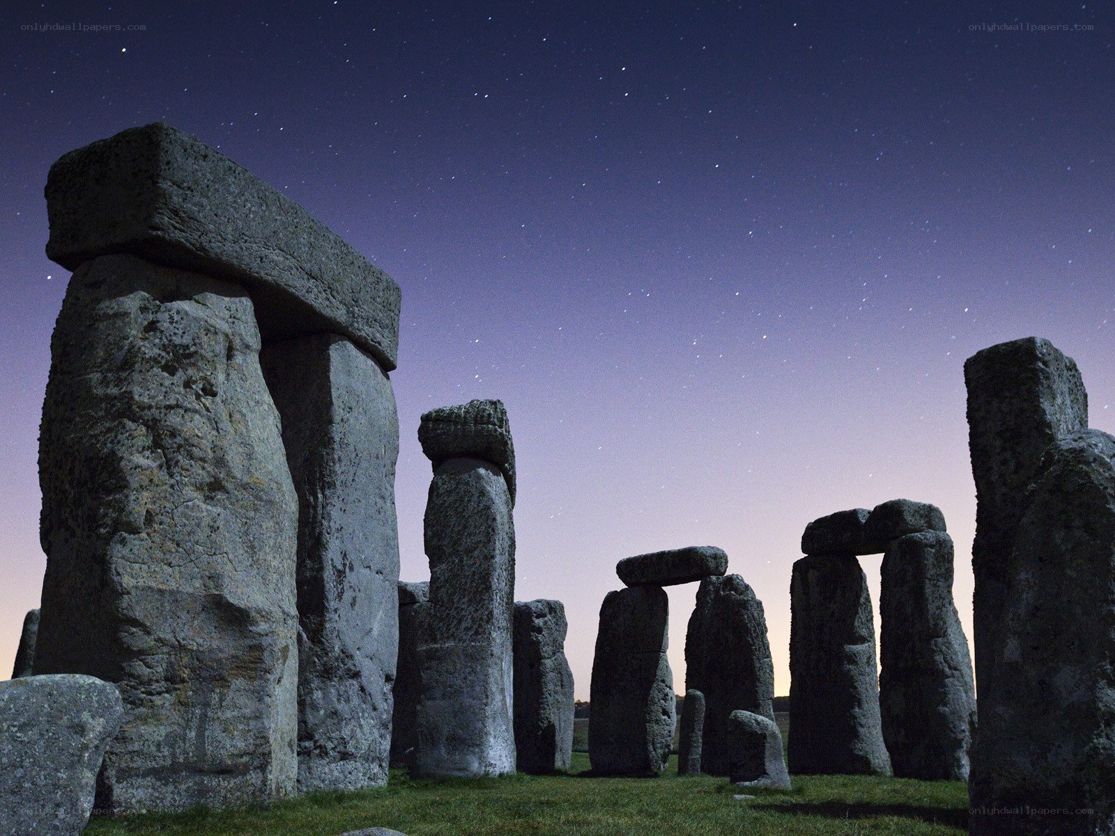 Stonehenge at night under stars