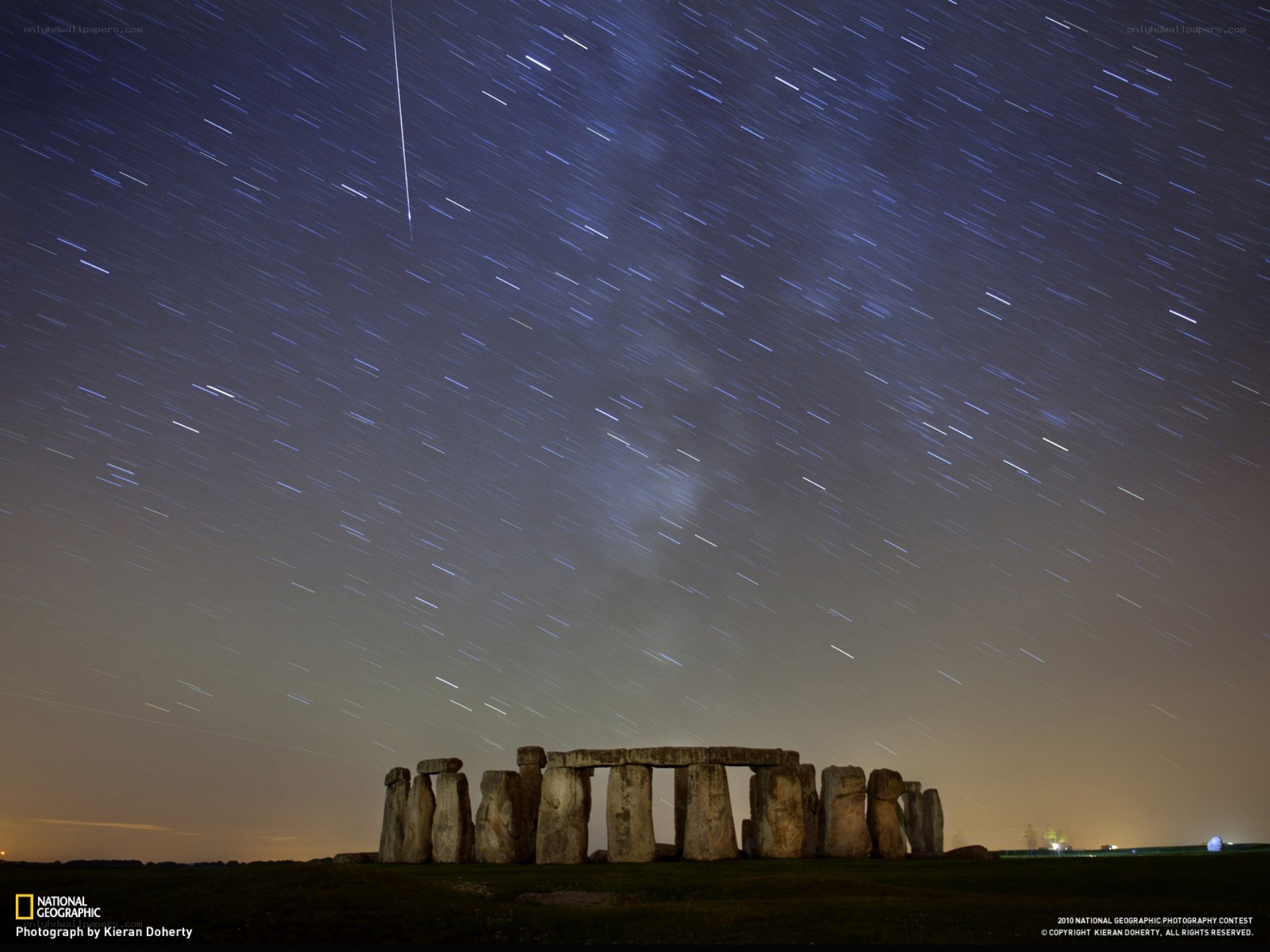 Stonehenge under star trails