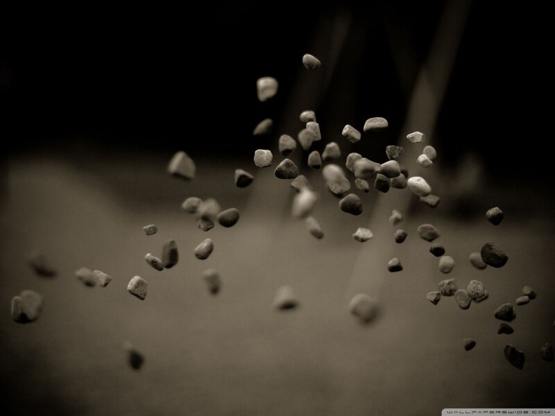 stones falling in sepia