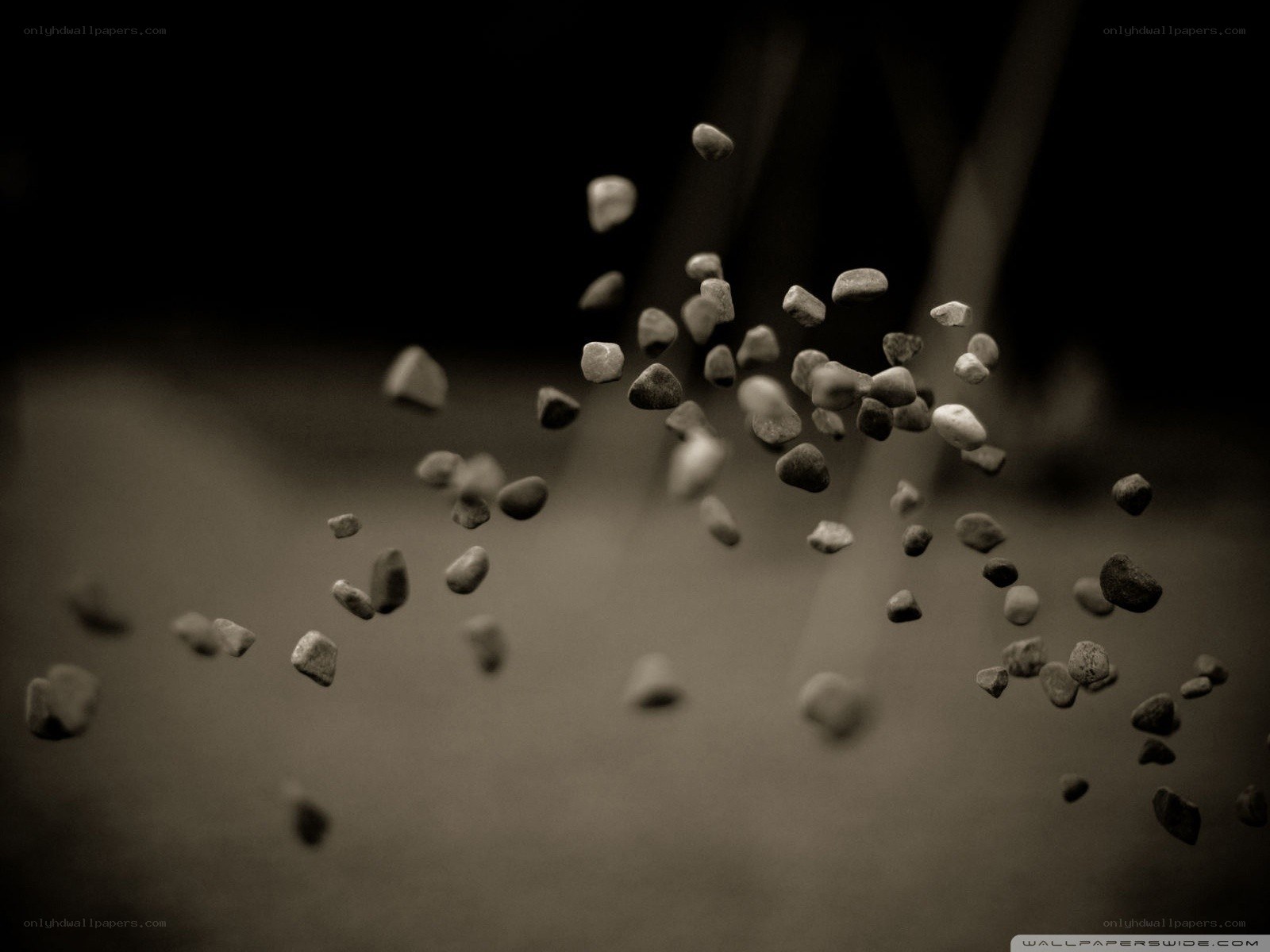 stones falling in sepia