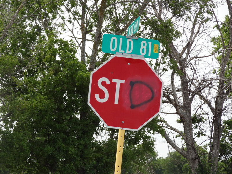 Stop Sign with Graffiti — Red