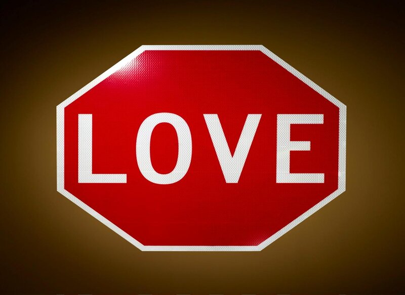 Stop sign with the word love
