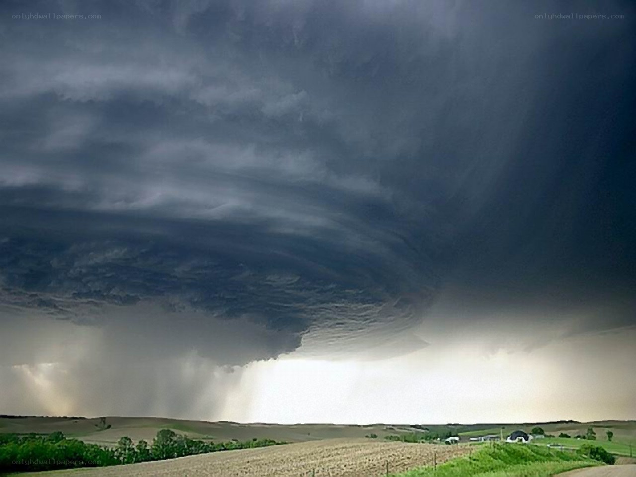 Storm cloud over farmland