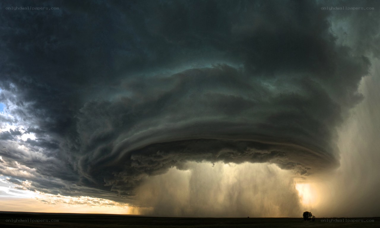 Storm cloud over open field