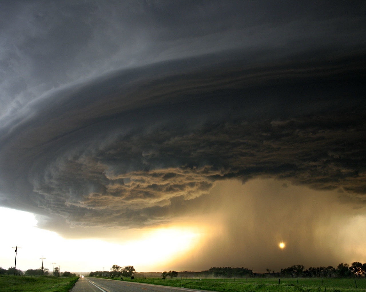 Storm cloud over rural road