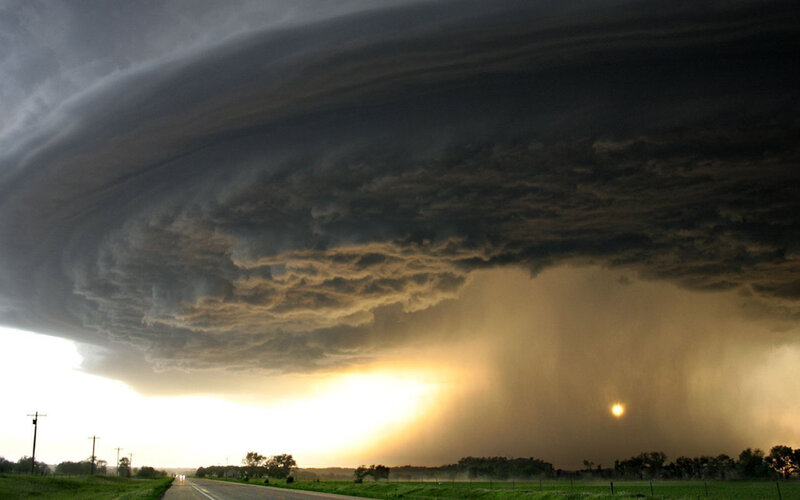 Storm cloud over rural road
