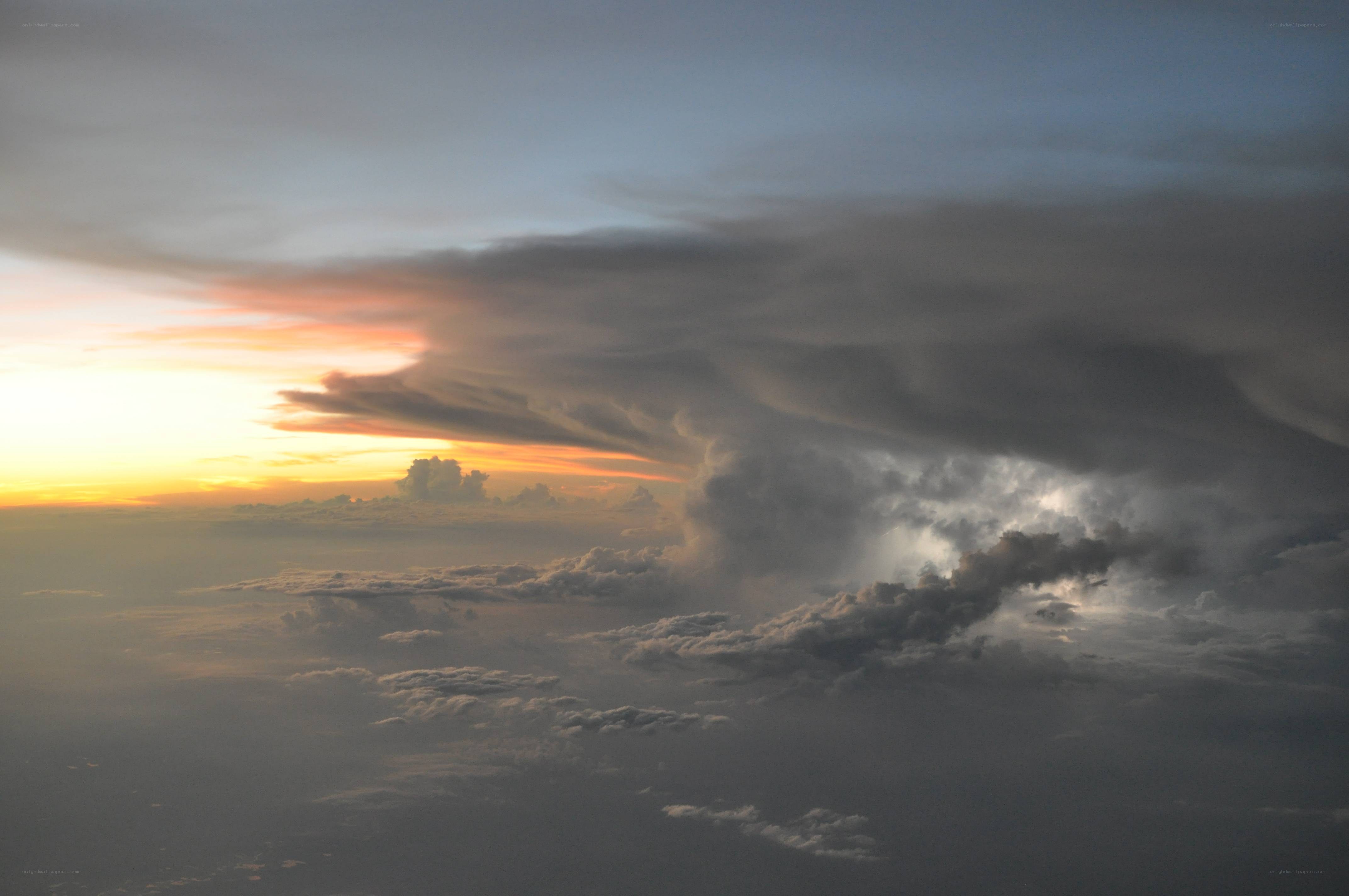Storm clouds at sunset from above