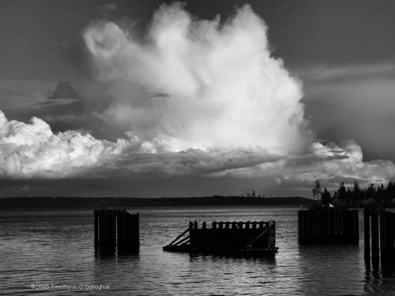 Storm clouds over a pier