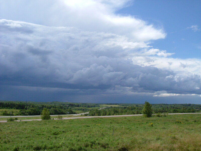 Storm clouds over a rural landscape