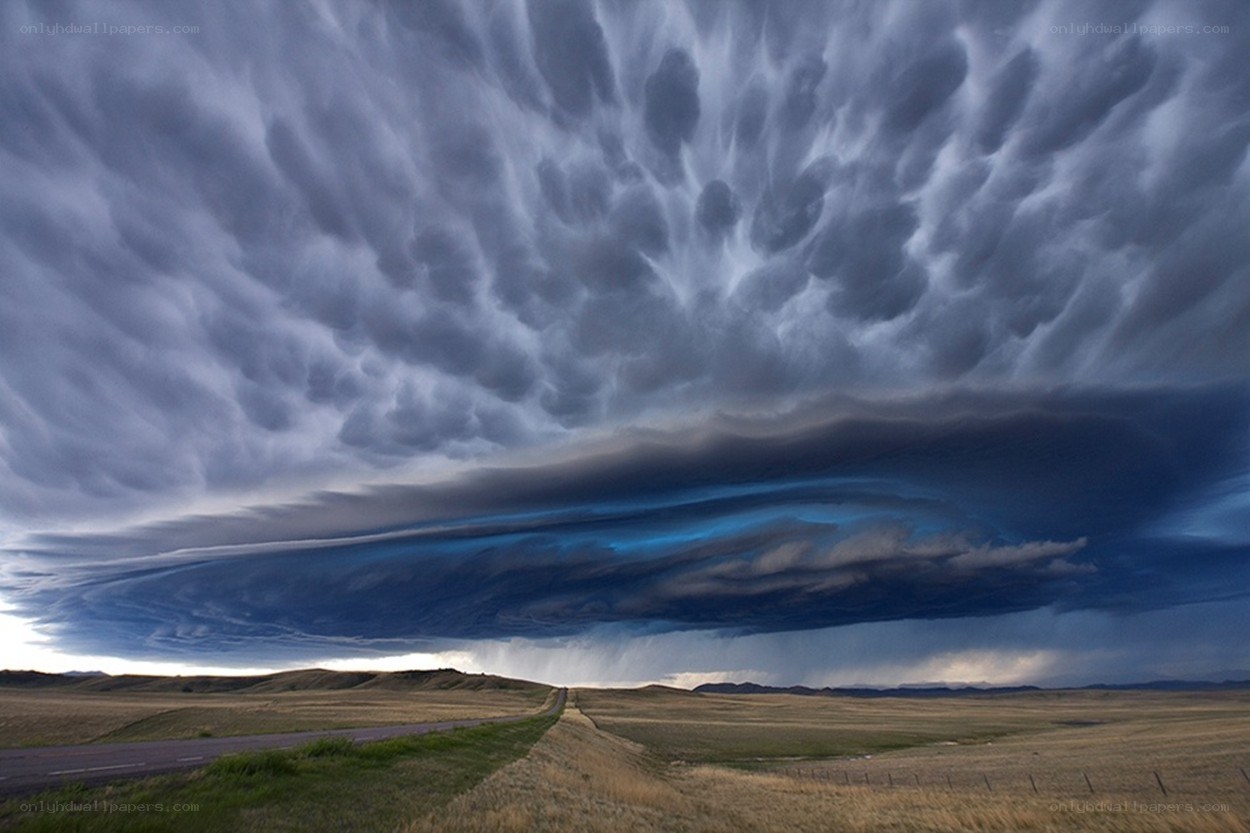 Storm clouds over a rural road