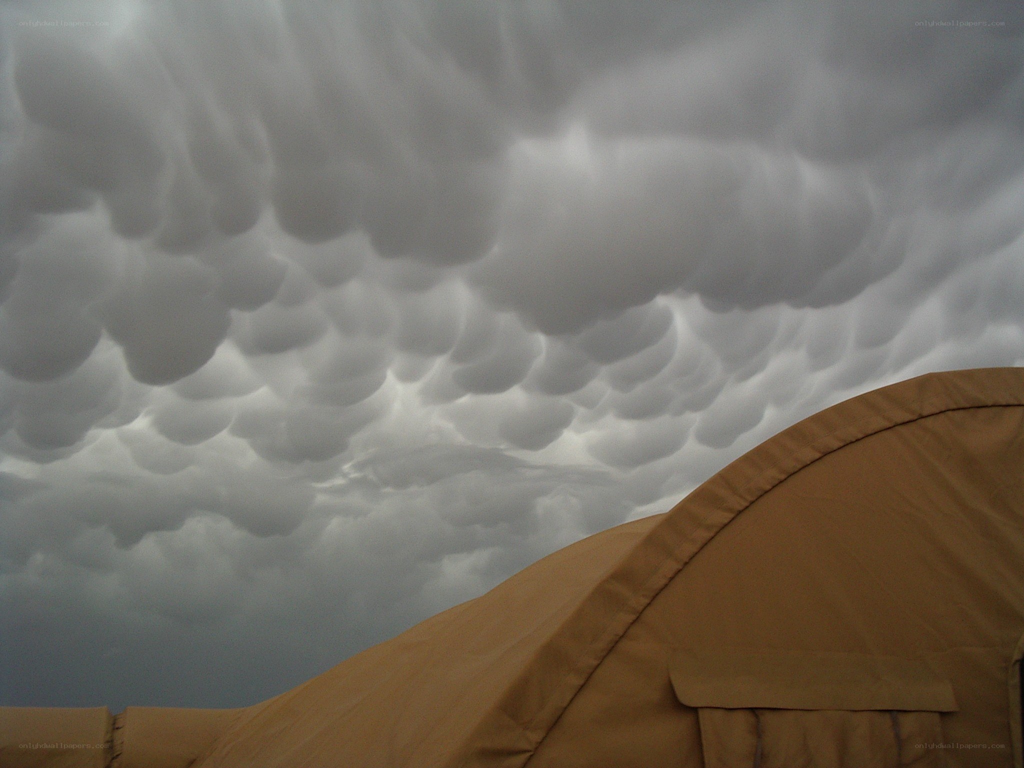 Storm clouds over a tent
