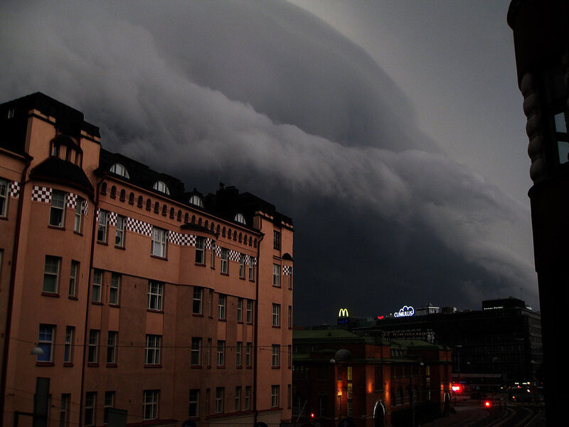 Storm clouds over city buildings