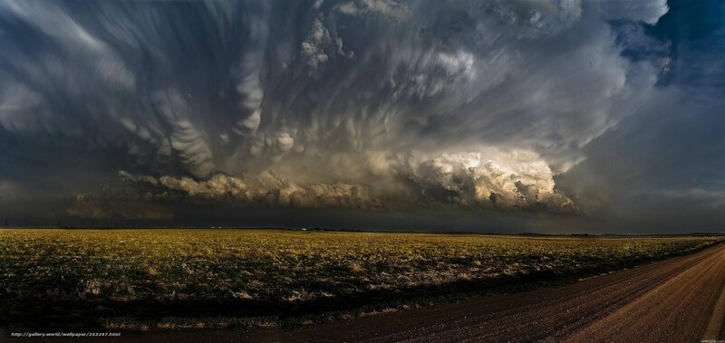 Storm clouds over farmland