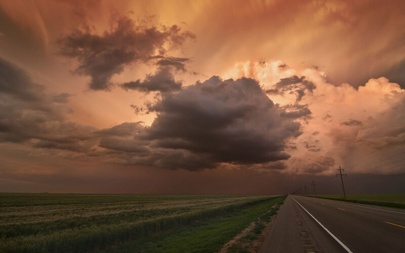 Storm Clouds over Highway — Orange, Dramatic, Sunset