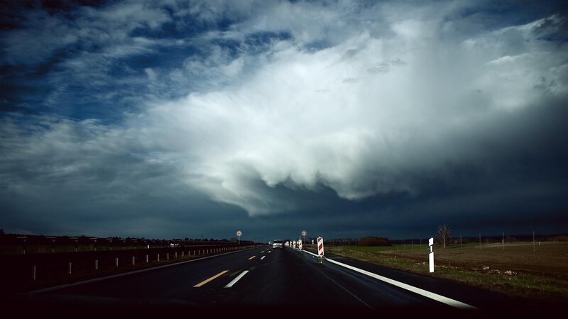 Storm clouds over highway