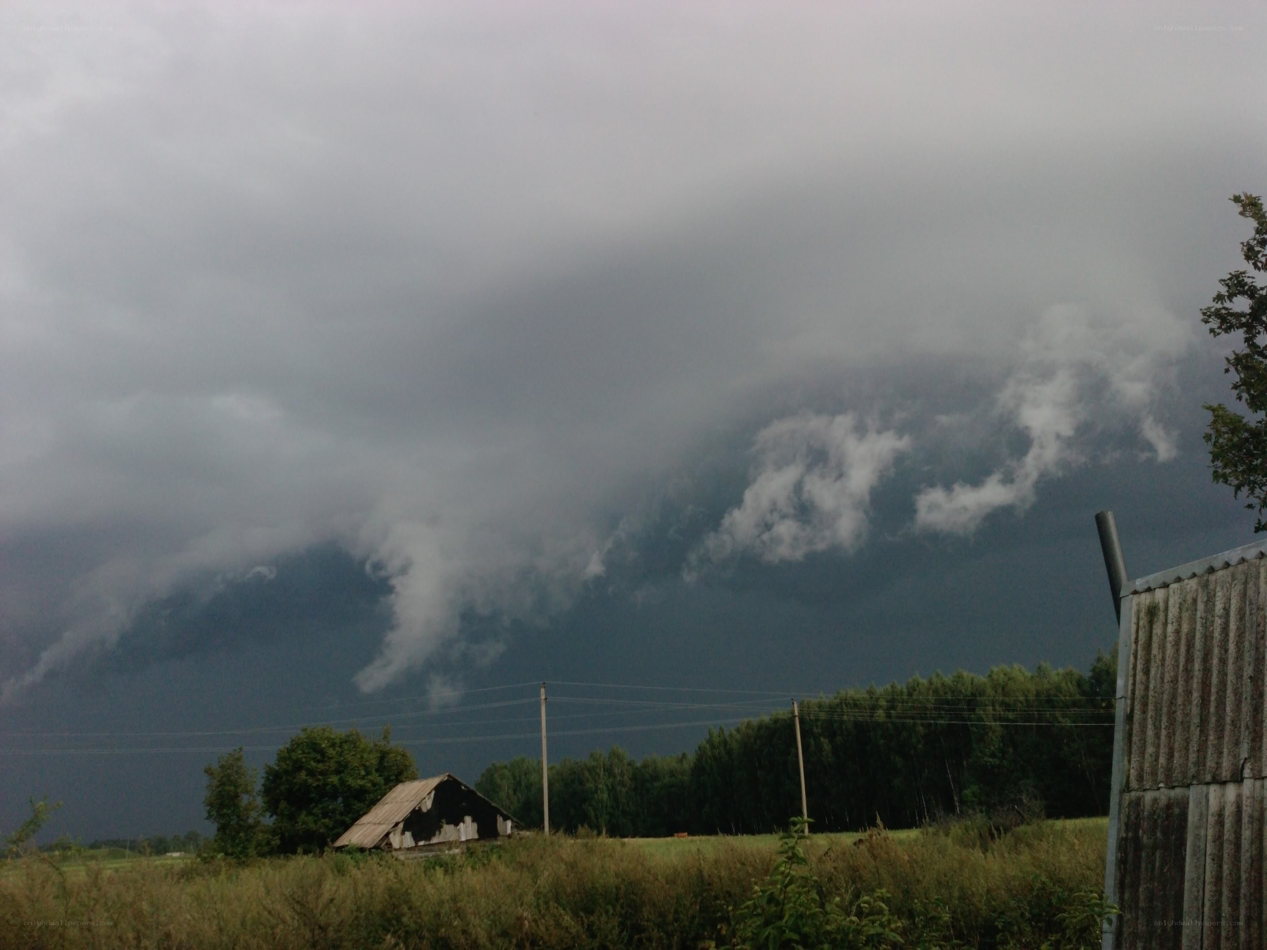 Storm clouds over rural landscape