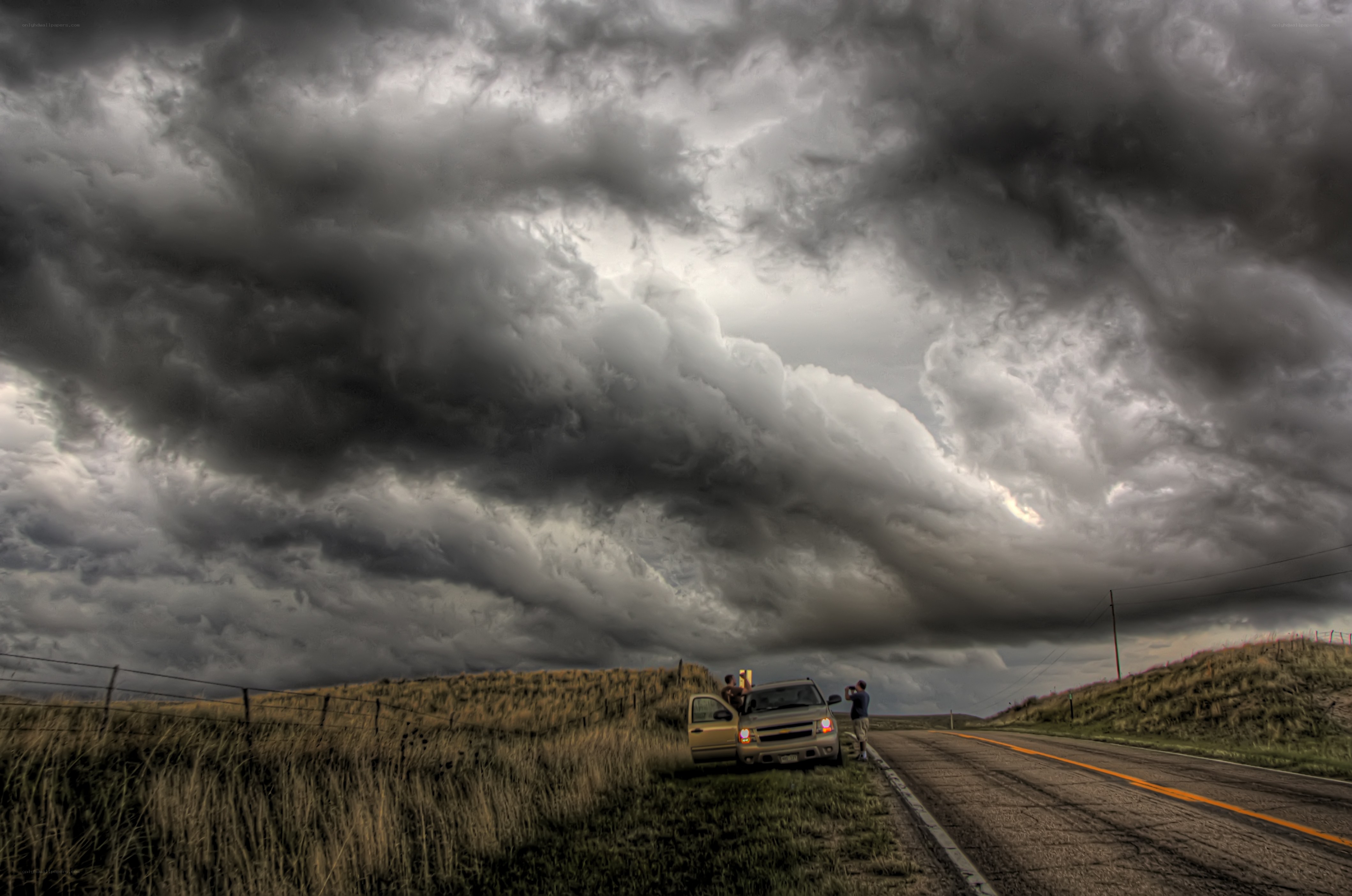 Storm clouds over rural road