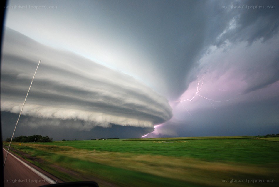 Storm over a green field