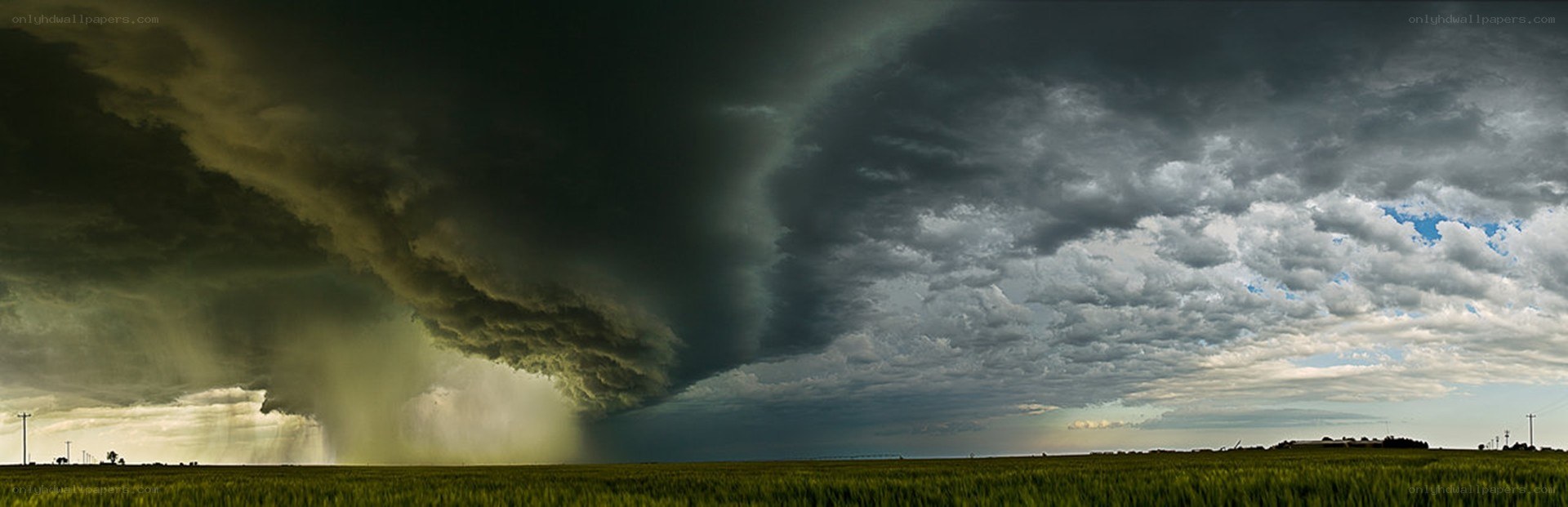 Storm over a green field