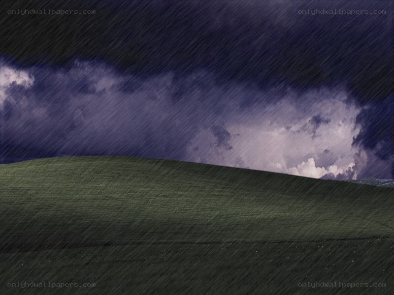 Storm over a green hill