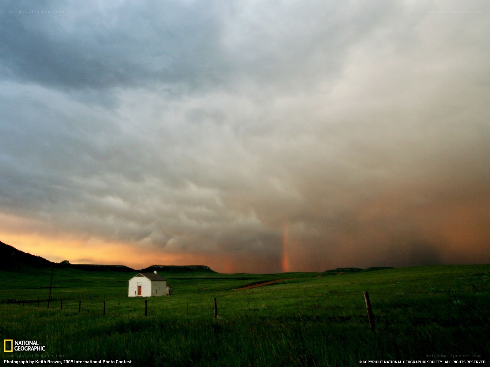 Storm over a rural cabin