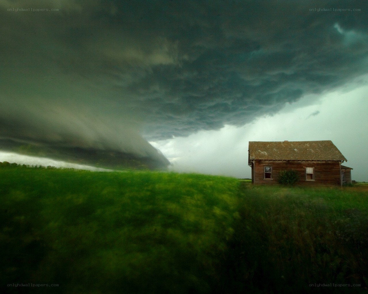 Storm over a rural cabin