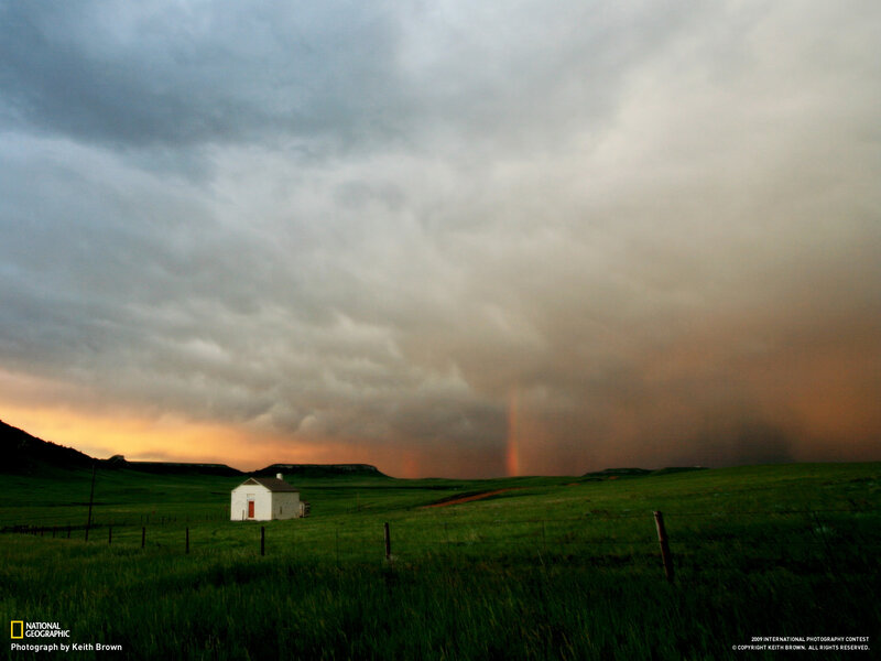 Storm over a rural cabin
