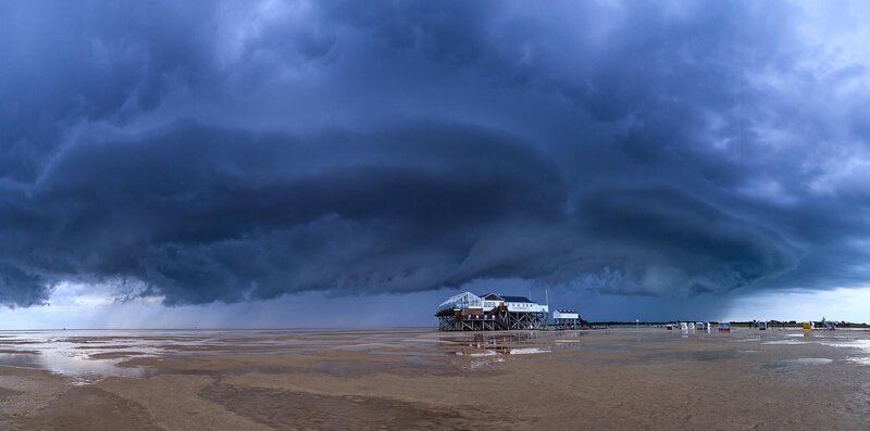 Storm over beach pier