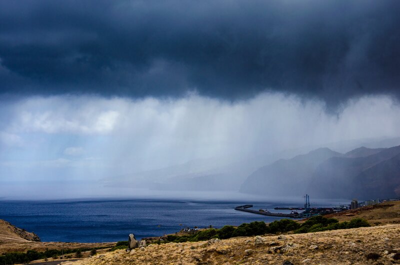 Storm over coastal harbor