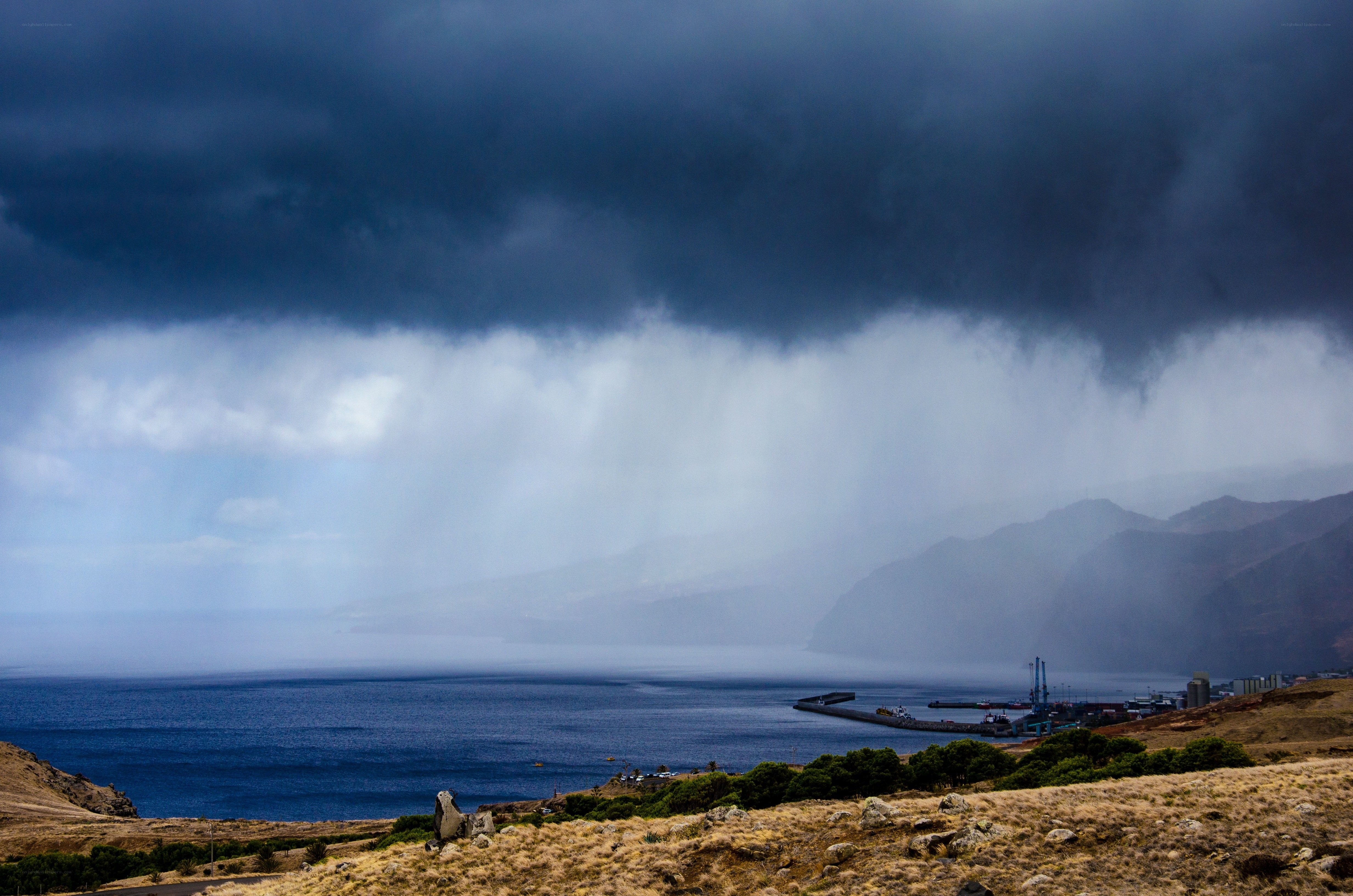 Storm over coastal harbor