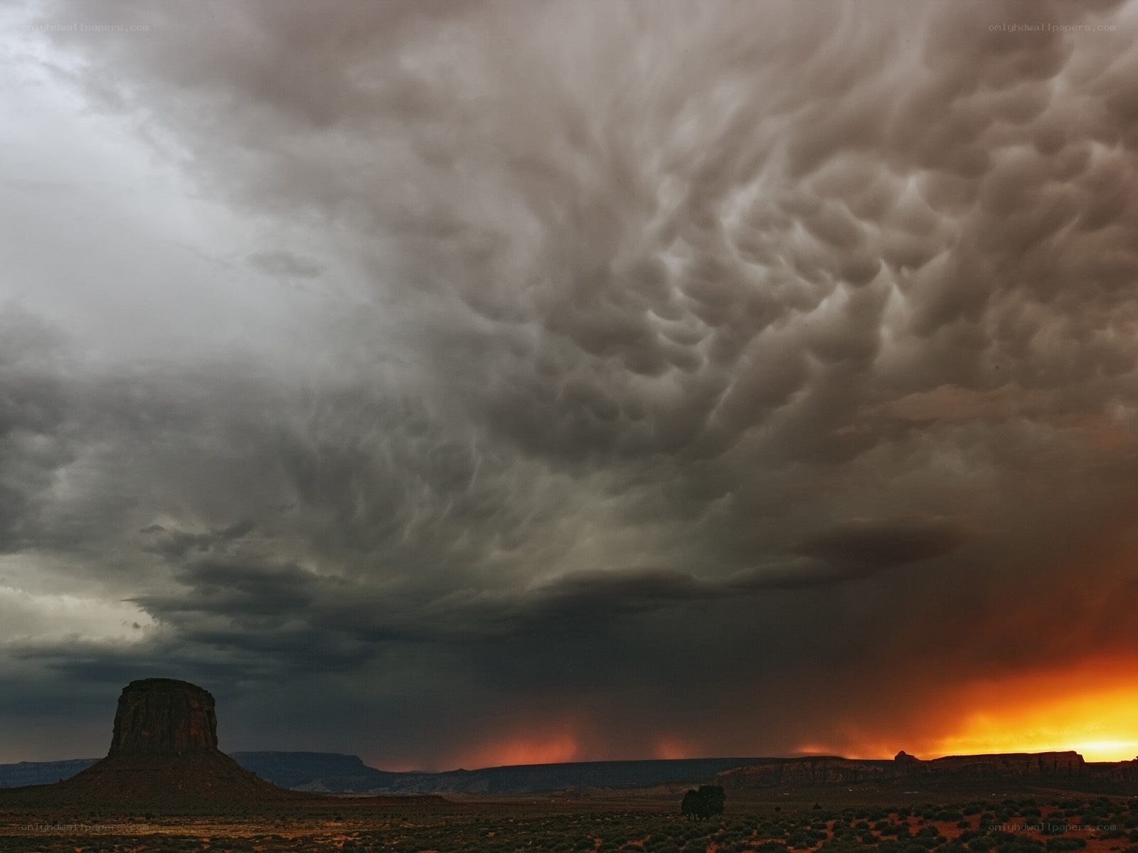 Storm over desert butte