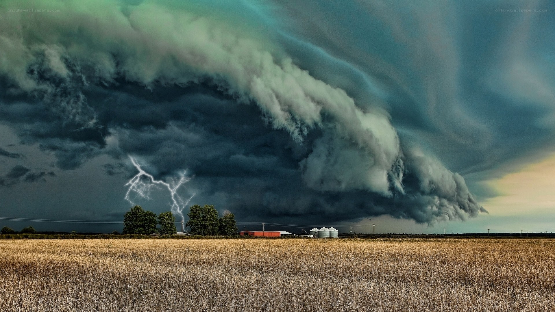 Storm over farmland with lightning