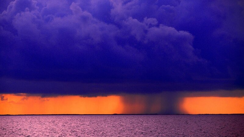 storm over ocean at sunset