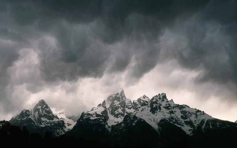 Storm over snow-capped mountains