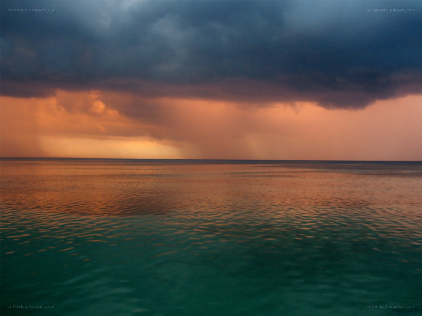 storm over the ocean at sunset