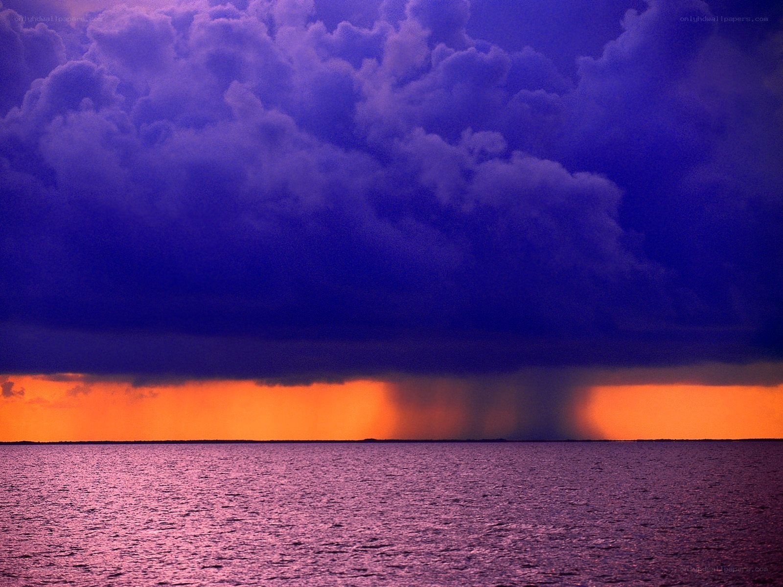 storm over the ocean at sunset