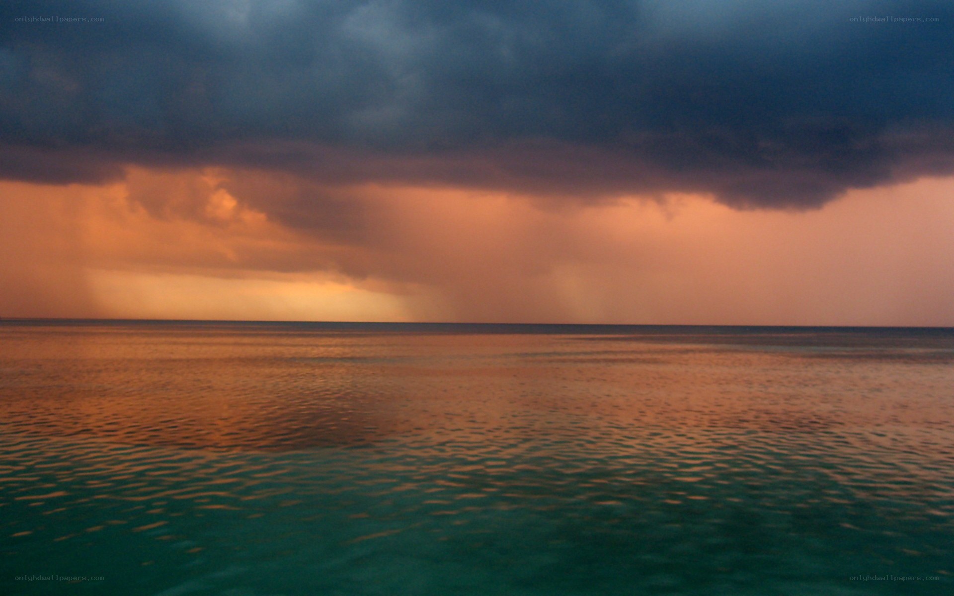 storm over the ocean at sunset