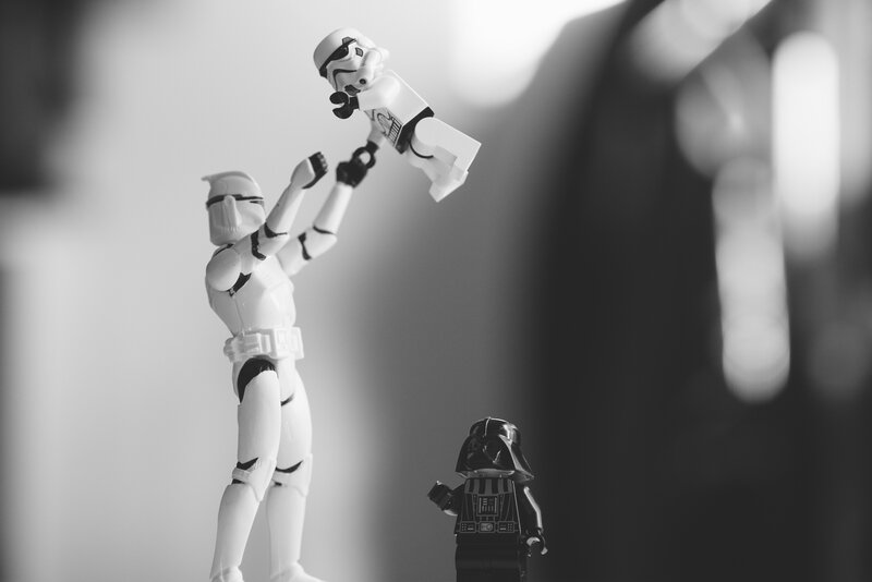 Stormtrooper Figurine Lifting Another