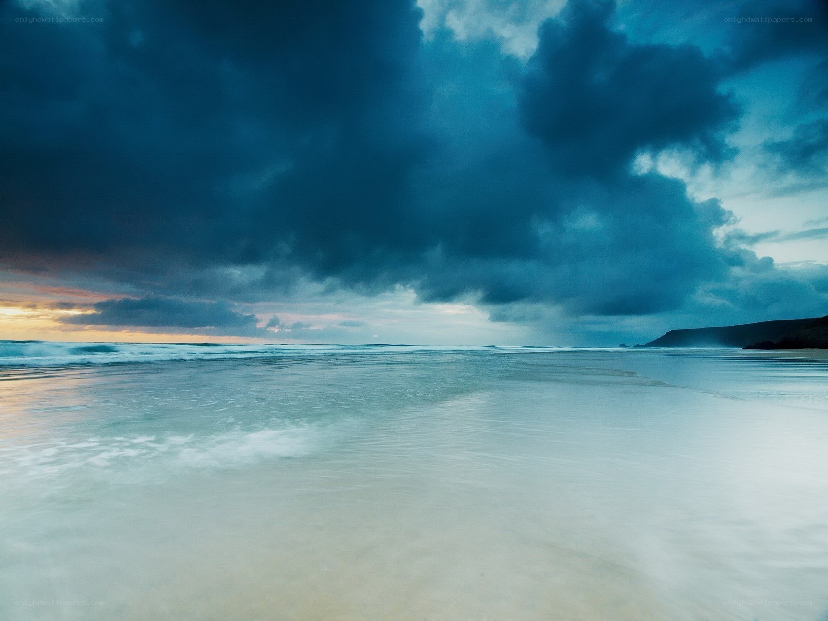 Stormy beach at dusk