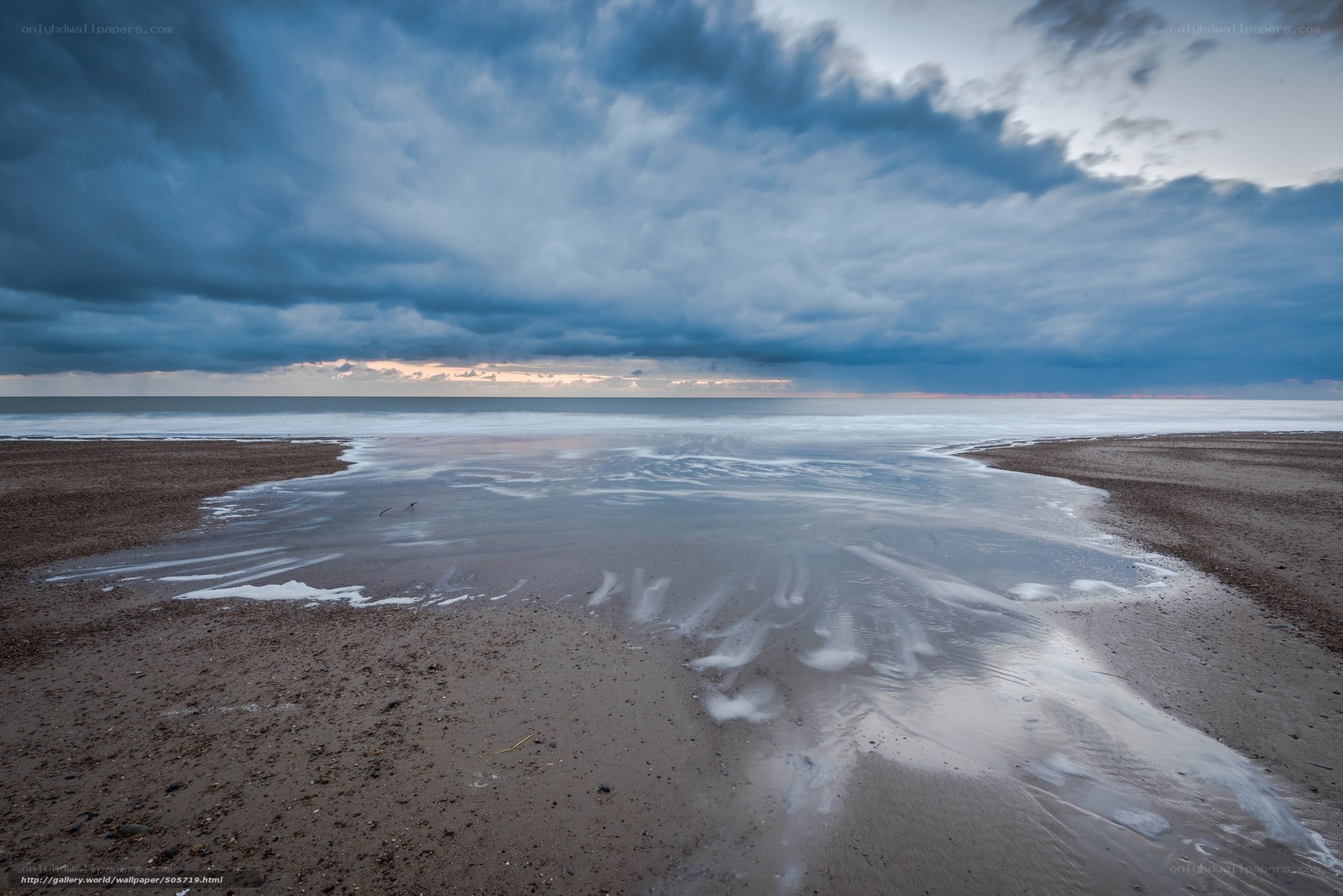 Stormy beach at dusk