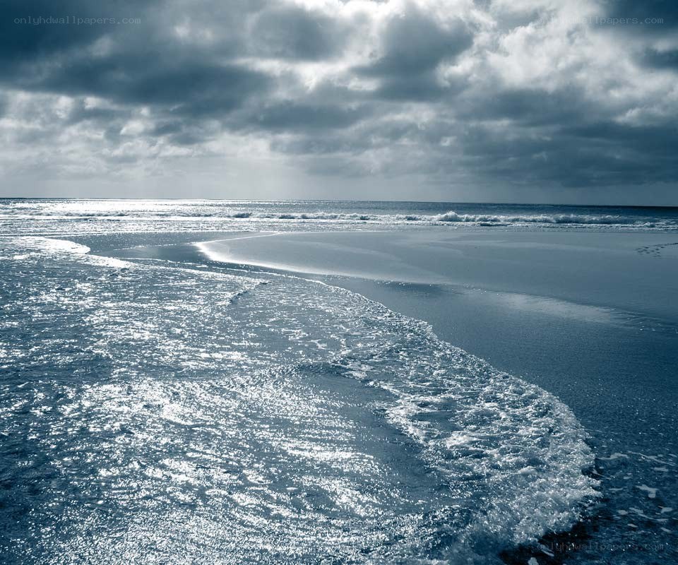 Stormy beach at sunset