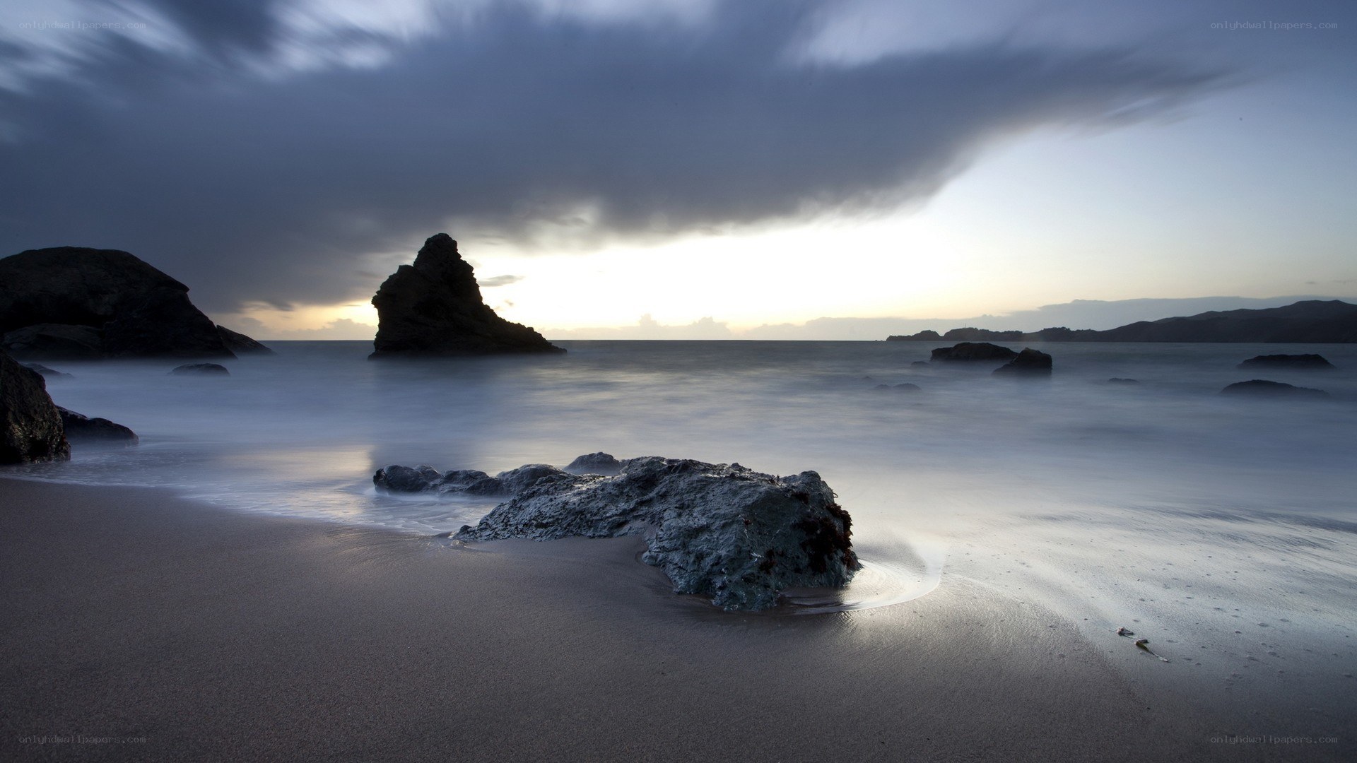 Stormy beach at sunset