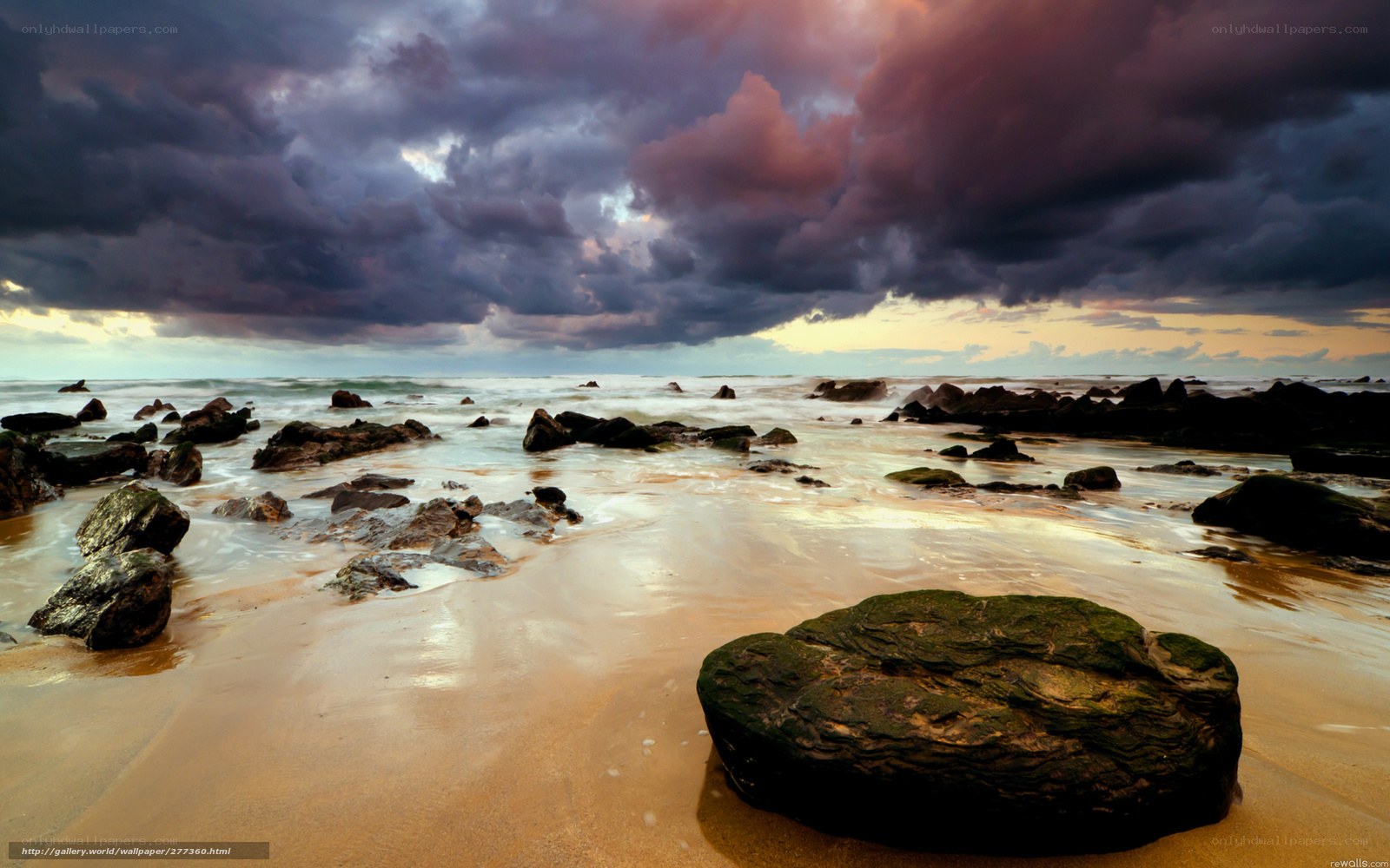 Stormy beach at sunset