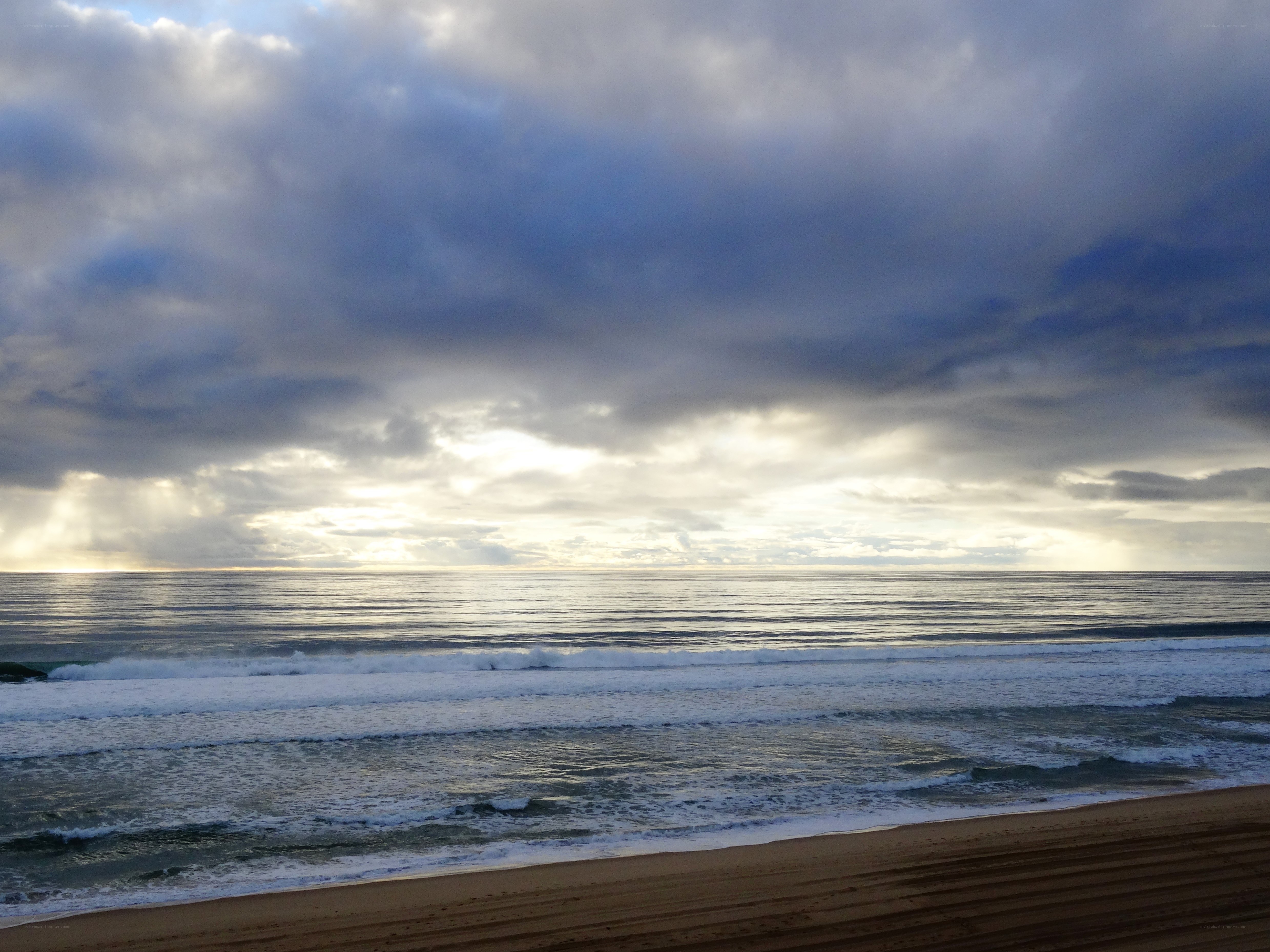 Stormy beach at sunset