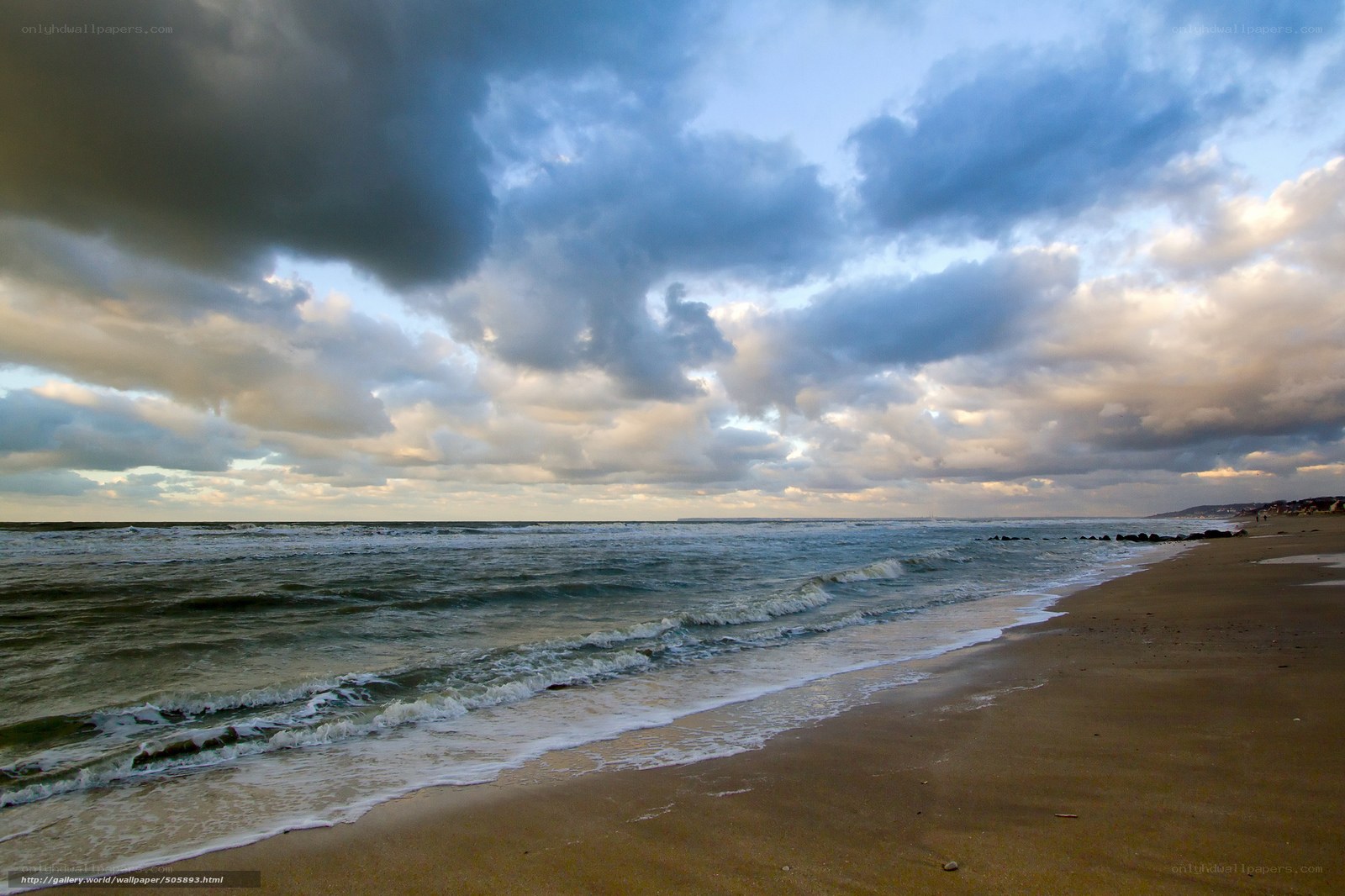 Stormy beach at sunset