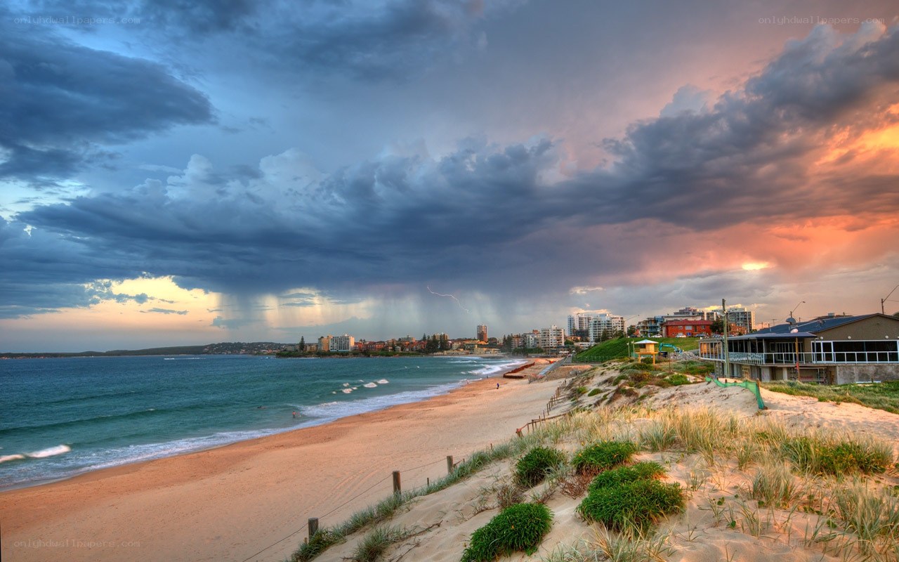 Stormy beach at sunset