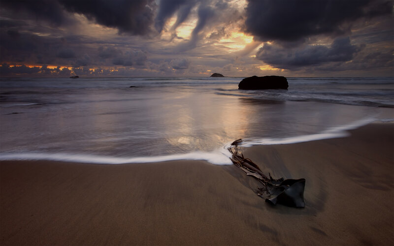 Stormy beach at sunset