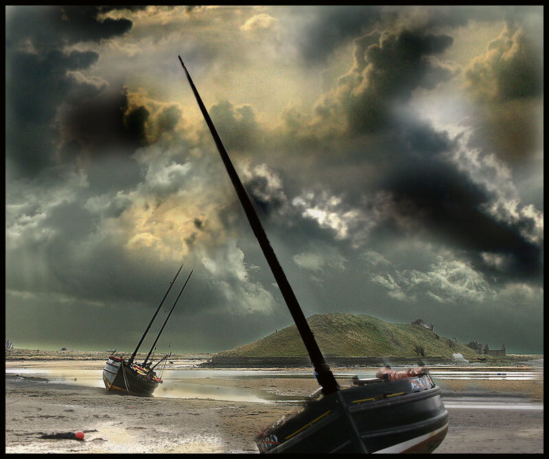 Stormy beach with beached boats