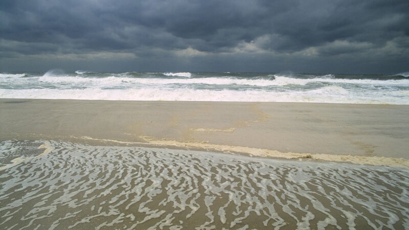 Stormy beach with crashing waves